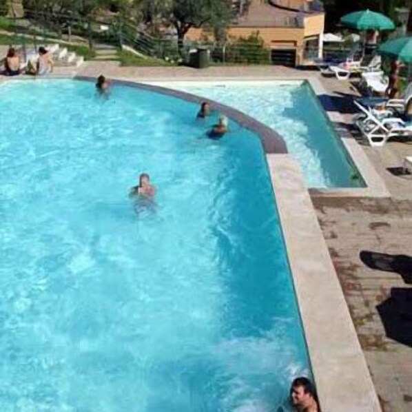 Outdoor pool, open 8:30 AM to 6:00 PM, pool umbrellas, pool loungers