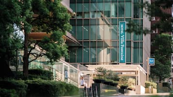 A modern hotel building with a prominent sign for 'Hotel Villa Fontaine.'