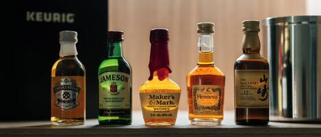 A selection of whiskey bottles on a shelf.