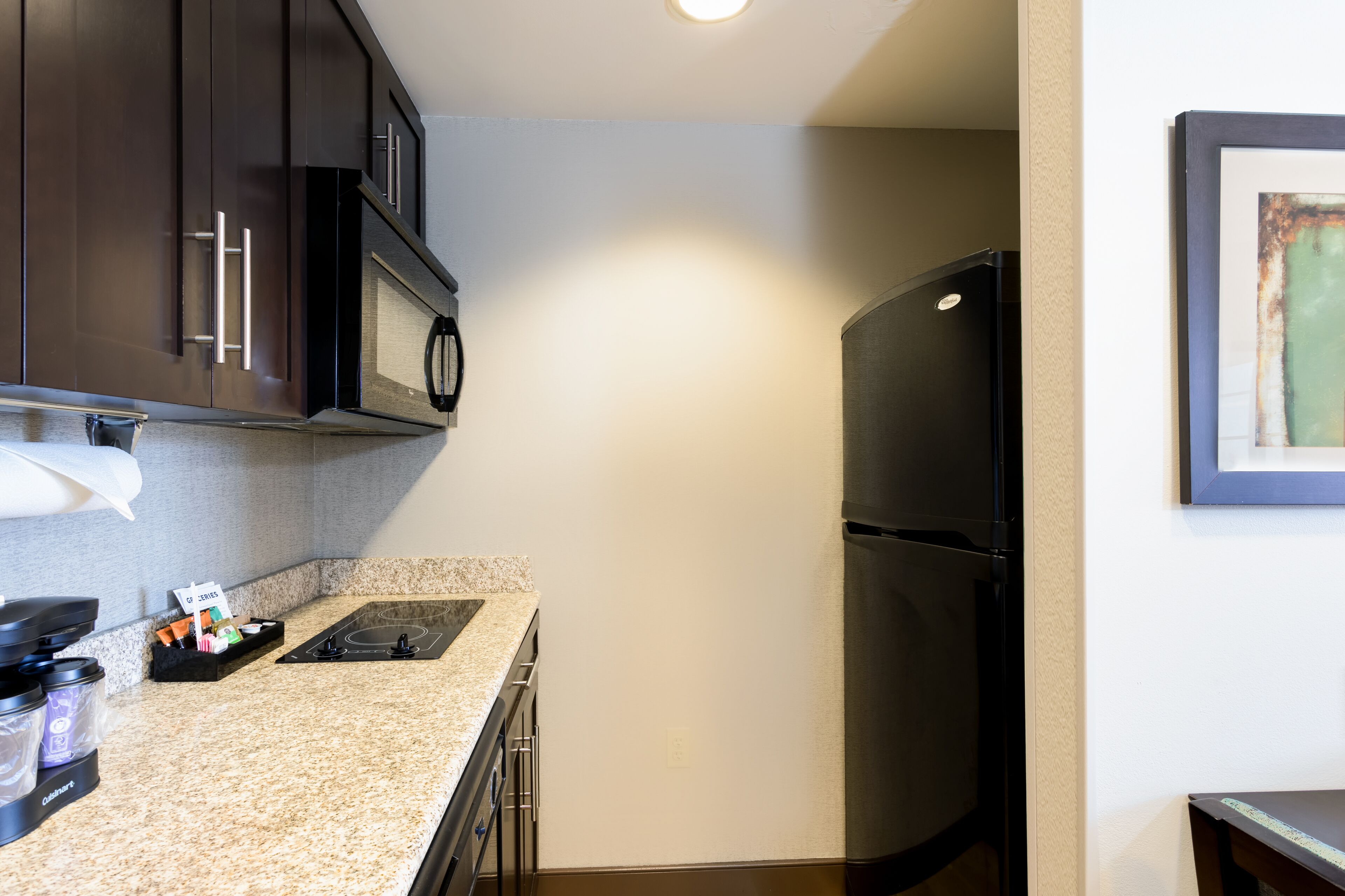 full-sized fridge, microwave, stovetop, dishwasher