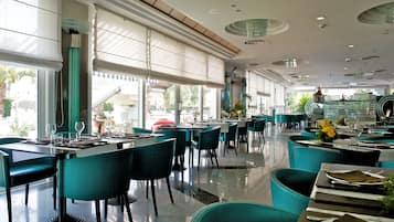 Breakfast, lunch, dinner served; international cuisine, pool views