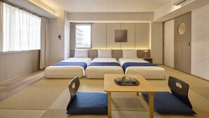 A hotel room with two beds, a small table with a tray, and a view of the city through the window. - Village Kyoto close by Shijo Omiya station (Kyoto)
