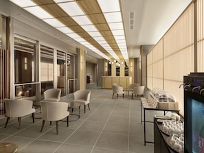 A modern hotel lobby with seating areas, a reception desk, and a bar. - Village Kyoto close by Shijo Omiya station (Kyoto)