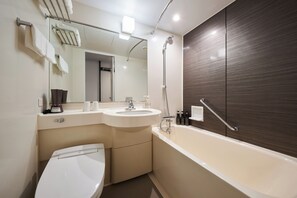 Combined shower/tub, free toiletries, hair dryer, slippers