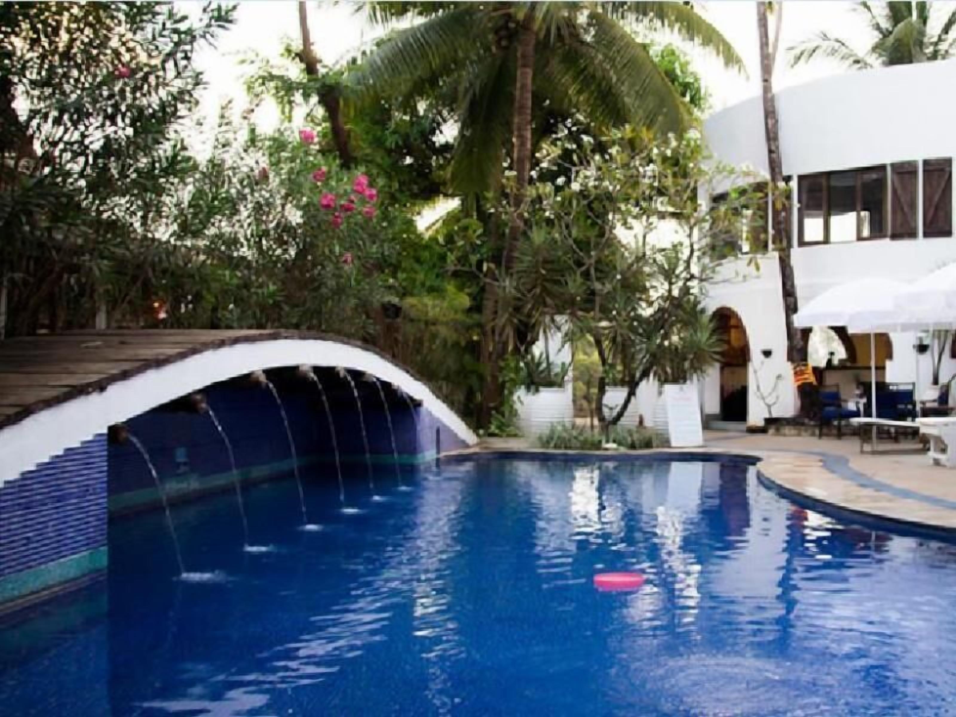 outdoor pool, pool umbrellas, pool loungers