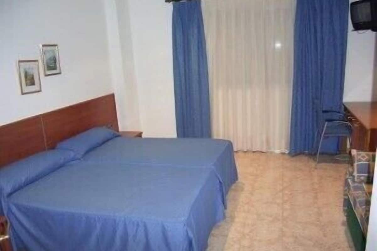 Select Comfort beds, desk, blackout curtains, iron/ironing board
