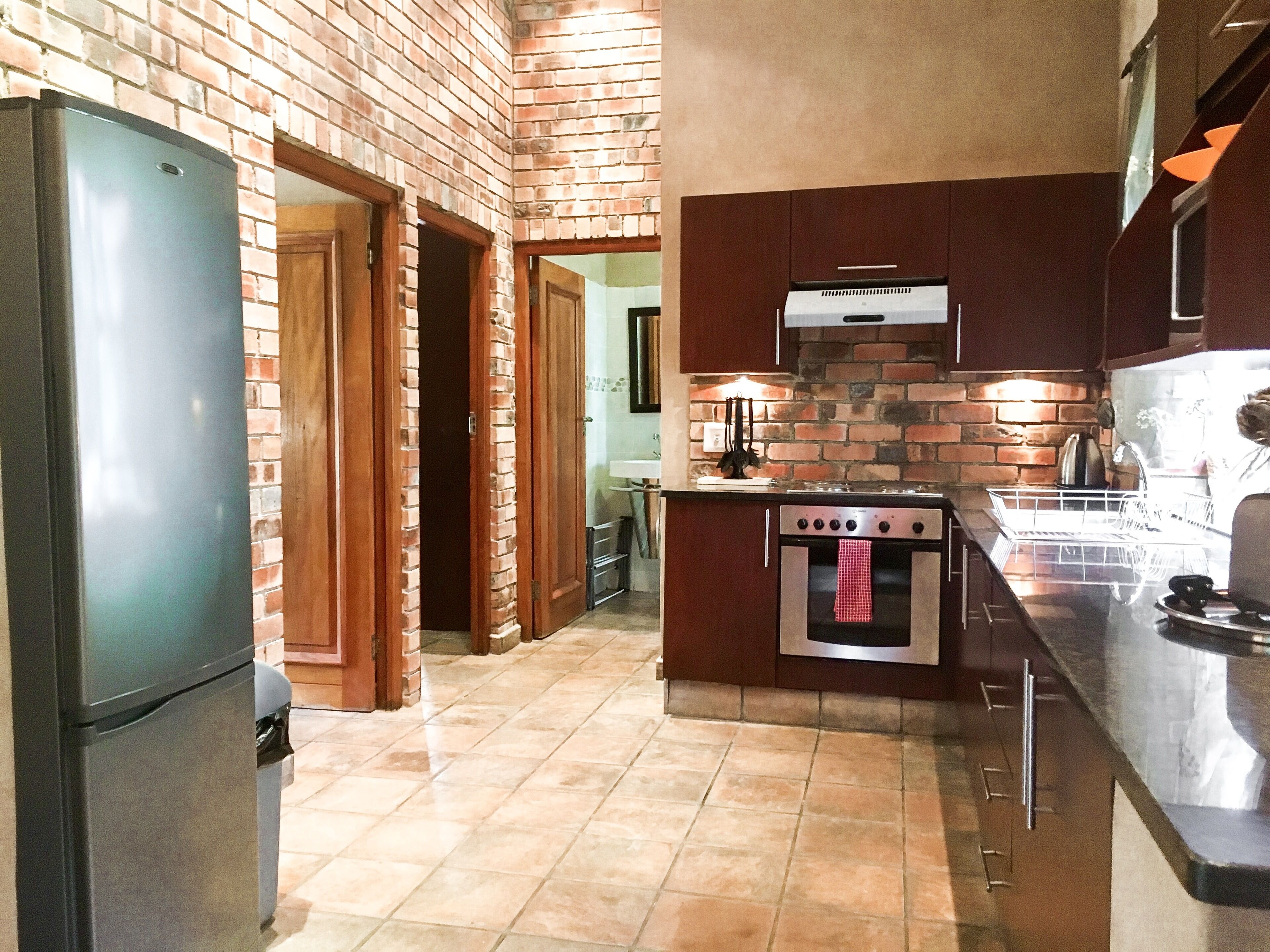 family apartment, 2 bedrooms, patio, garden view | private kitchen | full-sized fridge, microwave, oven, stovetop