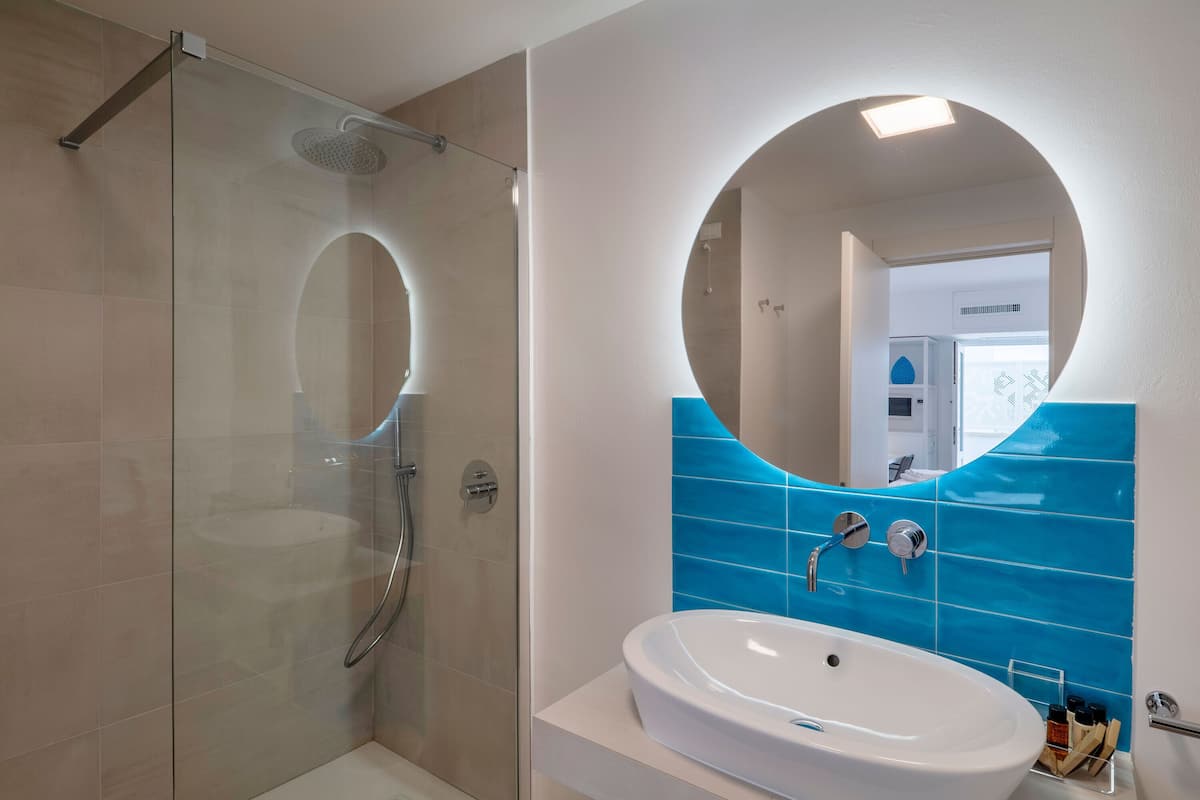 superior double room | bathroom | shower, free toiletries, hair dryer, slippers