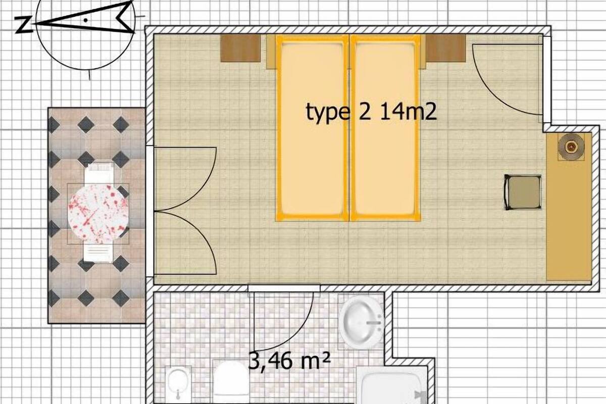 A floor plan with two double rooms, a bathroom, and a dining area.