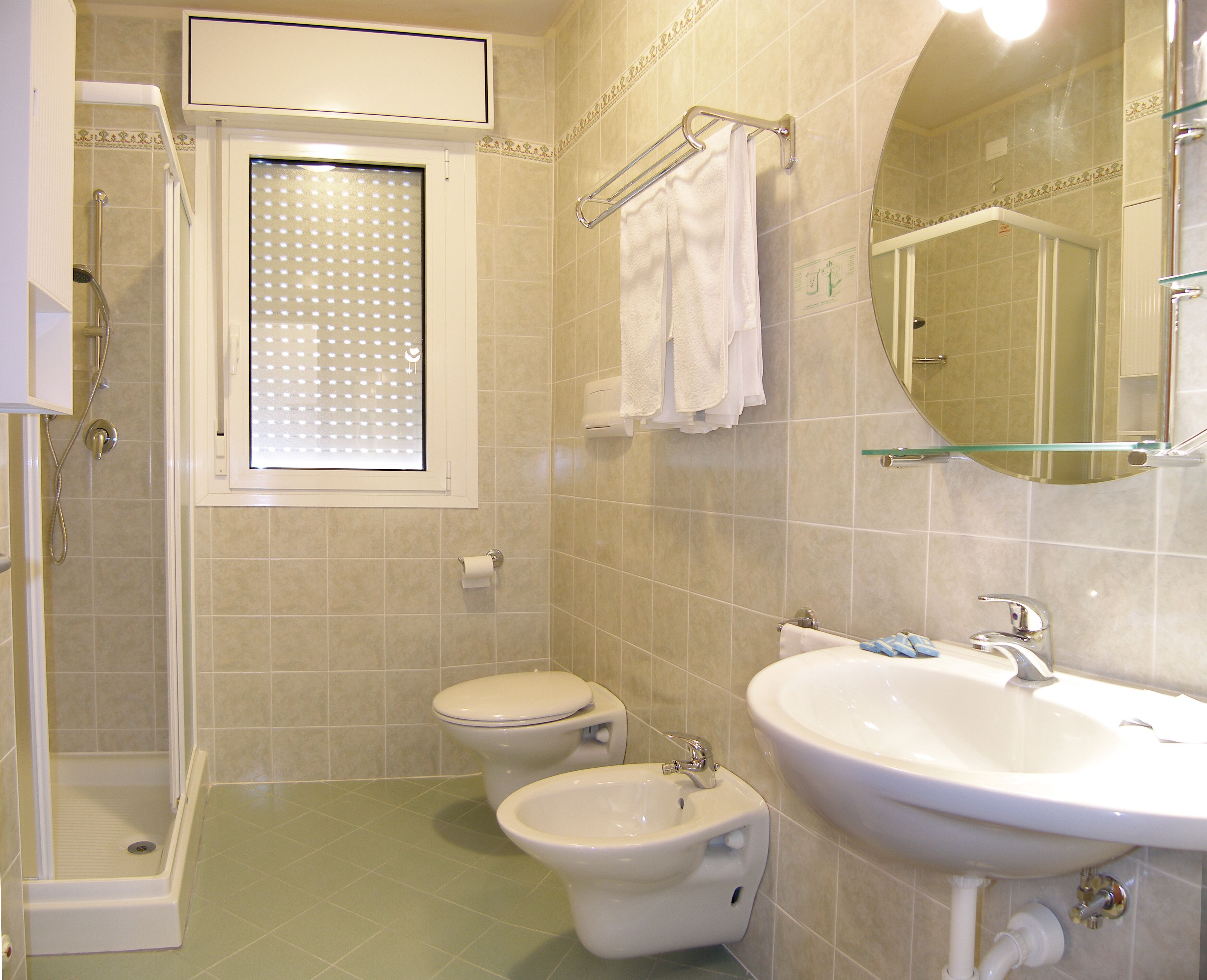 rainfall showerhead, hair dryer, bidet, towels