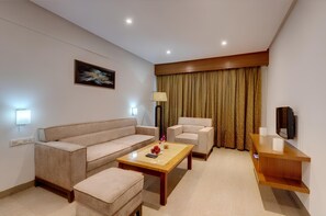 Suite | Living area | 21-inch LCD TV with cable channels, TV