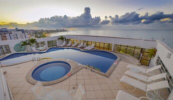 Outdoor pool, open 8:00 AM to 8:00 PM, sun loungers