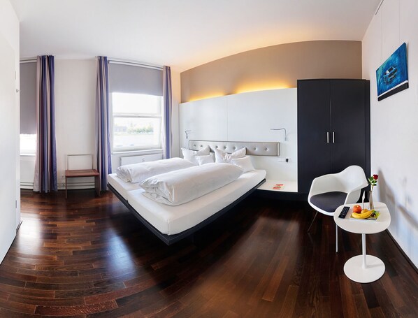 Premium bedding, down comforters, memory foam beds, in-room safe