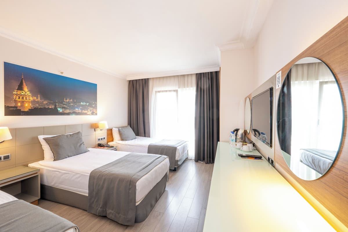 Habitación triple | 1 habitación, ropa de cama de alta calidad y camas Select Comfort
