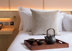 Chambre Deluxe | Literie hypoallergénique, minibar, coffre-fort pour ordinateur portable