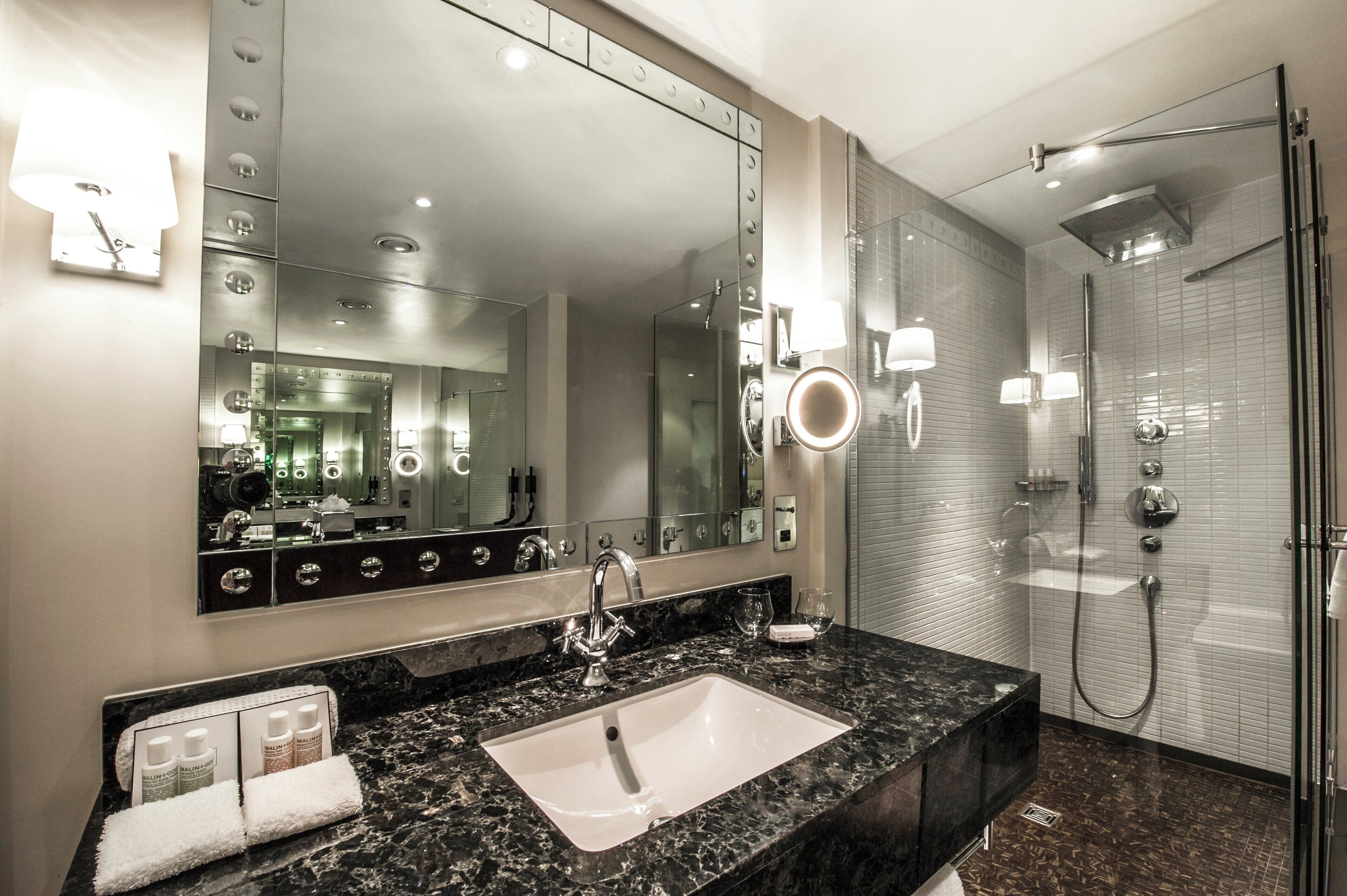 combined shower/bathtub, rainfall showerhead, designer toiletries