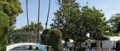 Outdoor pool, open 9:00 AM to 5:00 PM, pool loungers, lifeguards on site