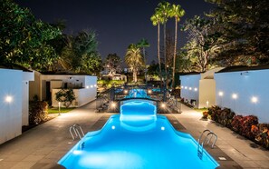 Outdoor pool, open 9:00 AM to 5:00 PM, pool loungers, lifeguards on site