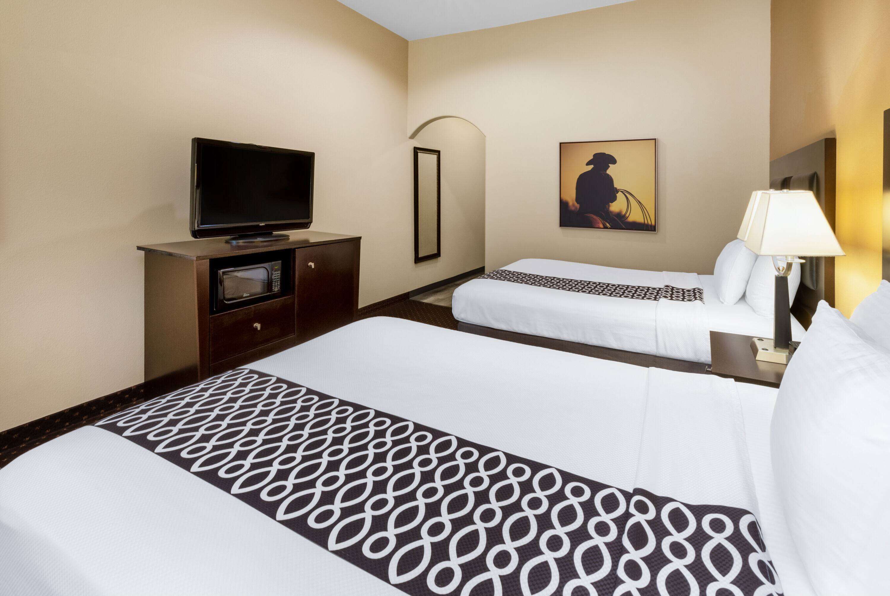 premium bedding, pillow-top beds, desk, laptop workspace