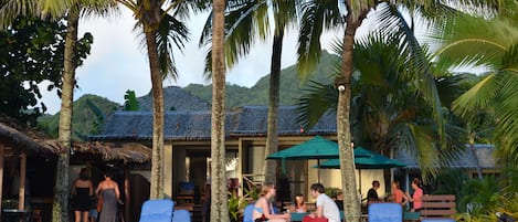 On the beach, white sand, sun-loungers, beach towels