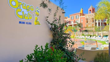 Located in a vibrant residential area, the Orgo Club features a lively atmosphere with lush greenery and a well-maintained garden.