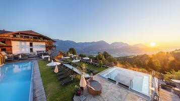 Relax by the pool surrounded by a wooden deck and take in the breathtaking mountain views.