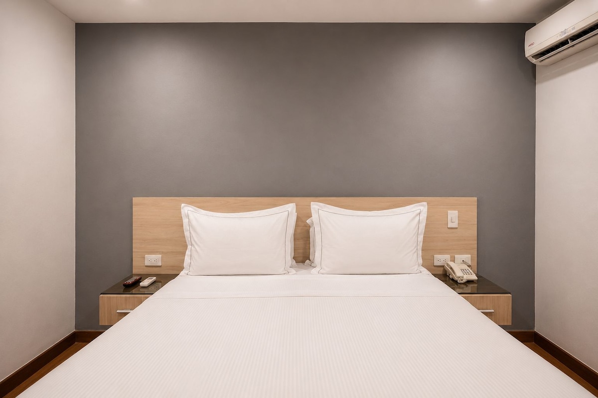 Standard Room, 1 Queen Bed, No Windows | Minibar, desk, laptop workspace, blackout curtains