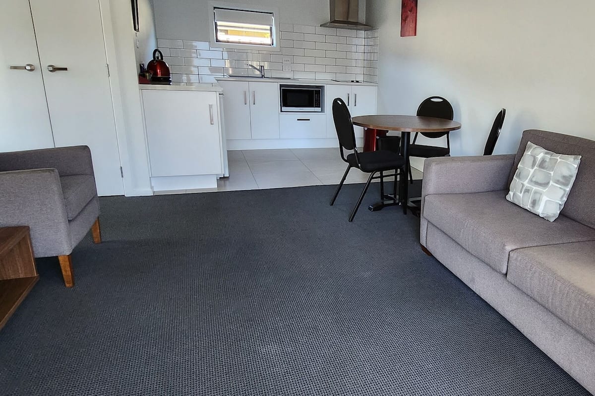 Family Apartment, 2 Bedrooms | Living area | 32-inch LCD TV with satellite channels, TV, heated floors