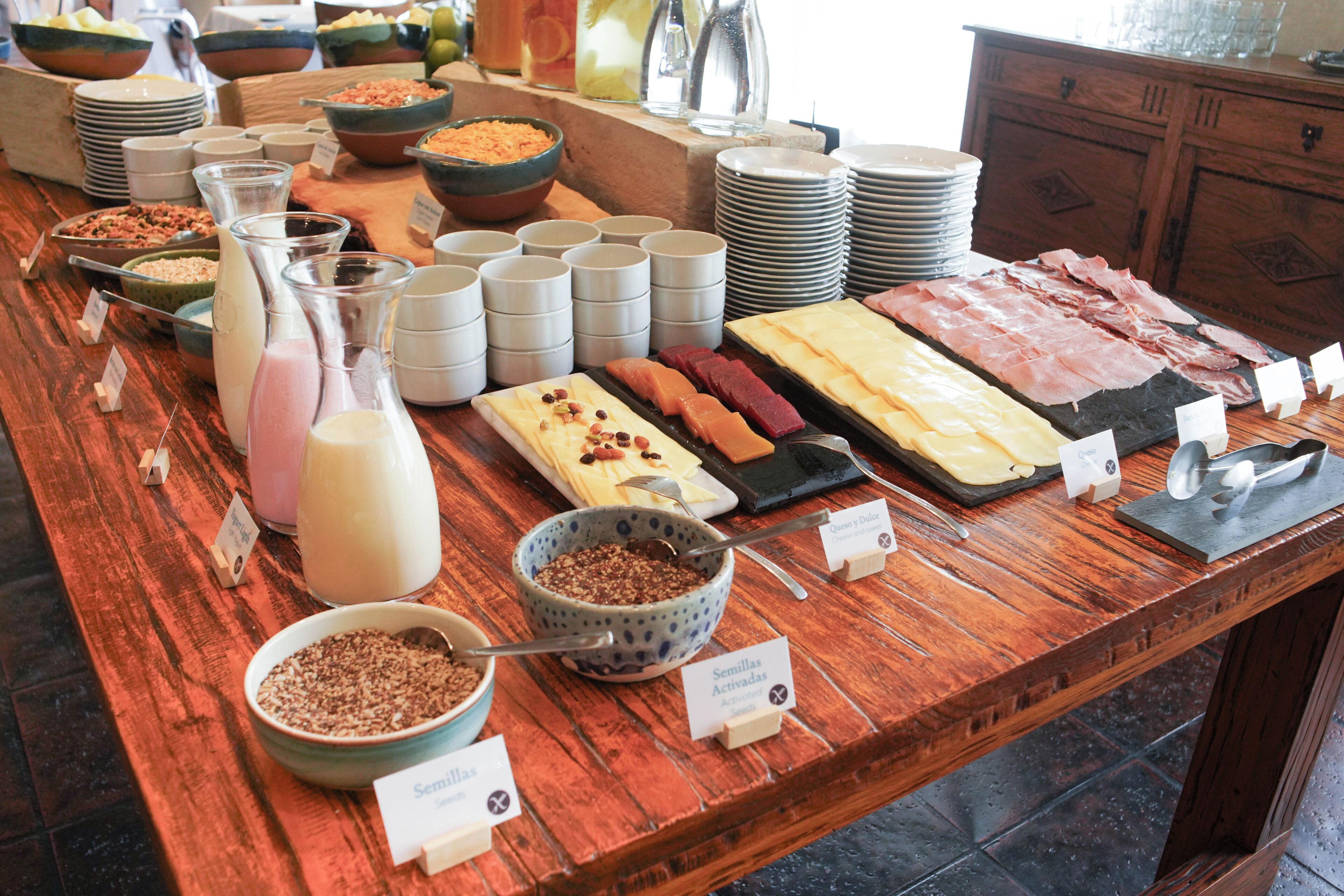 A buffet with various food items and beverages.