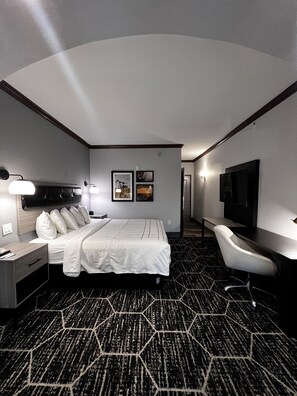 Premium bedding, desk, laptop workspace, blackout curtains