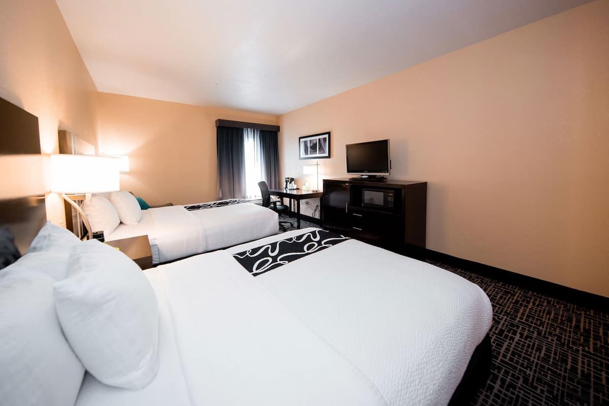 Premium bedding, desk, laptop workspace, blackout curtains
