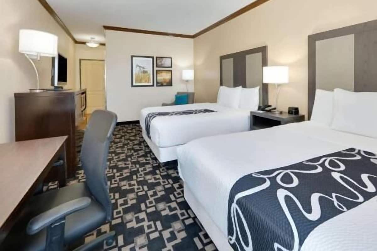 Premium bedding, desk, laptop workspace, blackout curtains