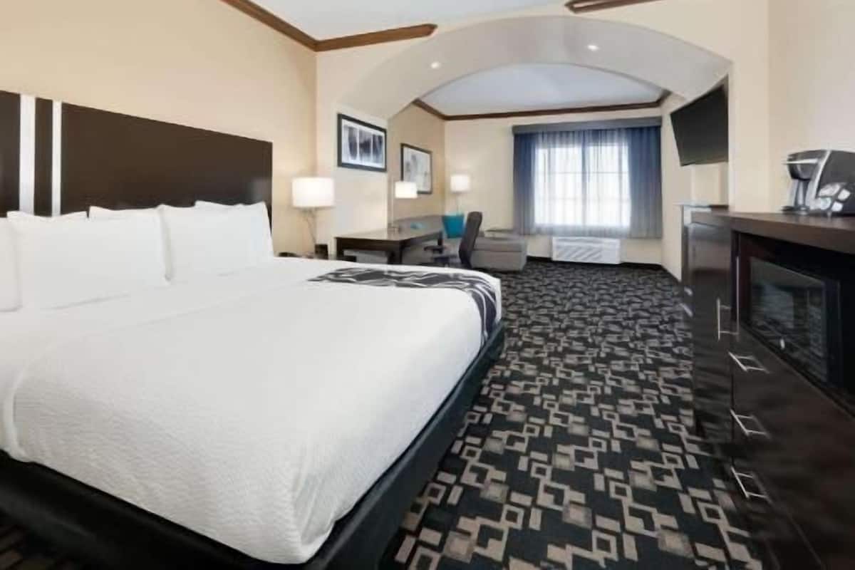 Premium bedding, desk, laptop workspace, blackout curtains