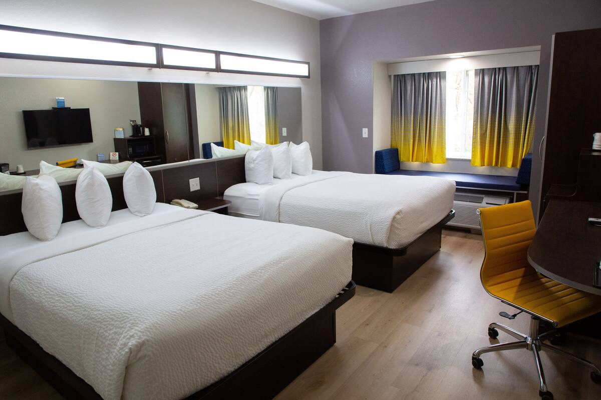 room, 2 queen beds, non smoking (pet friendly) | in-room safe, desk, iron/ironing board, free wifi