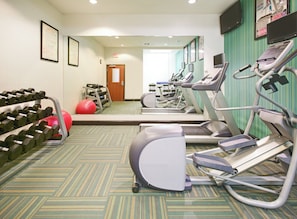 A gym with treadmills, dumbbells, and exercise balls. - Holiday Inn Express & Suites Denton North by IHG (Denton)