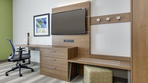 A modern office space with a desk, chair, and a television mounted on the wall. - Holiday Inn Express & Suites Denton North by IHG (Denton)