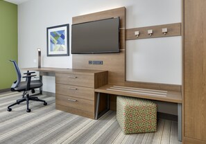 A modern office space with a desk, chair, and a television mounted on the wall. - Holiday Inn Express & Suites Denton North by IHG (Denton)