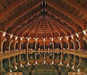 A large, open hall with a high, arched ceiling and multiple rows of seating. - Hortobagy Club Hotel (Hortobágy)