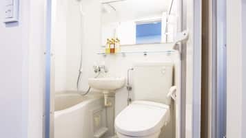 Combined shower/tub, free toiletries, hair dryer, slippers