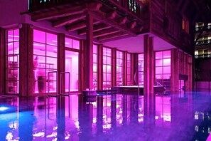A building with large windows and a reflective floor, possibly a hotel or public space. - Raffl´s Tyrol Hotel (Sankt Anton am Arlberg)