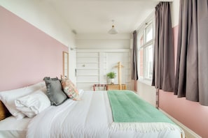 Premium bedding, blackout drapes, iron/ironing board, free WiFi