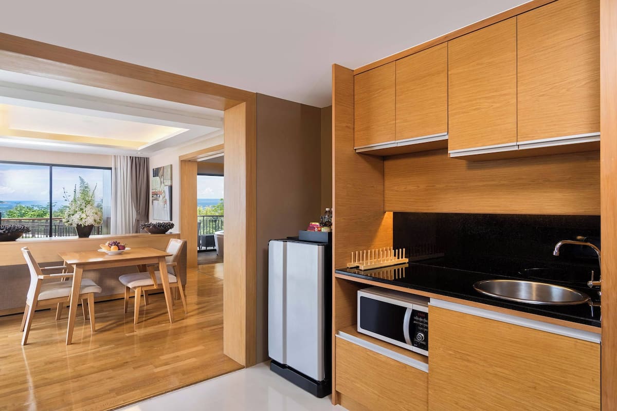 family suite, 1 king bed, balcony, sea view | living area | 42-inch lcd tv with satellite channels, tv, table football