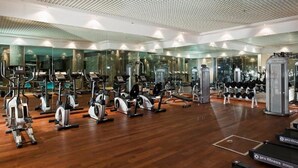 A modern gym with various cardio machines, weightlifting equipment, and mirrors on the walls. - Anemon Hotel Malatya (Malatya)