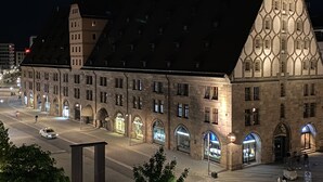 A historic building with a prominent tower and arched windows. - Hotel Deutscher Kaiser (Nuremberg)
