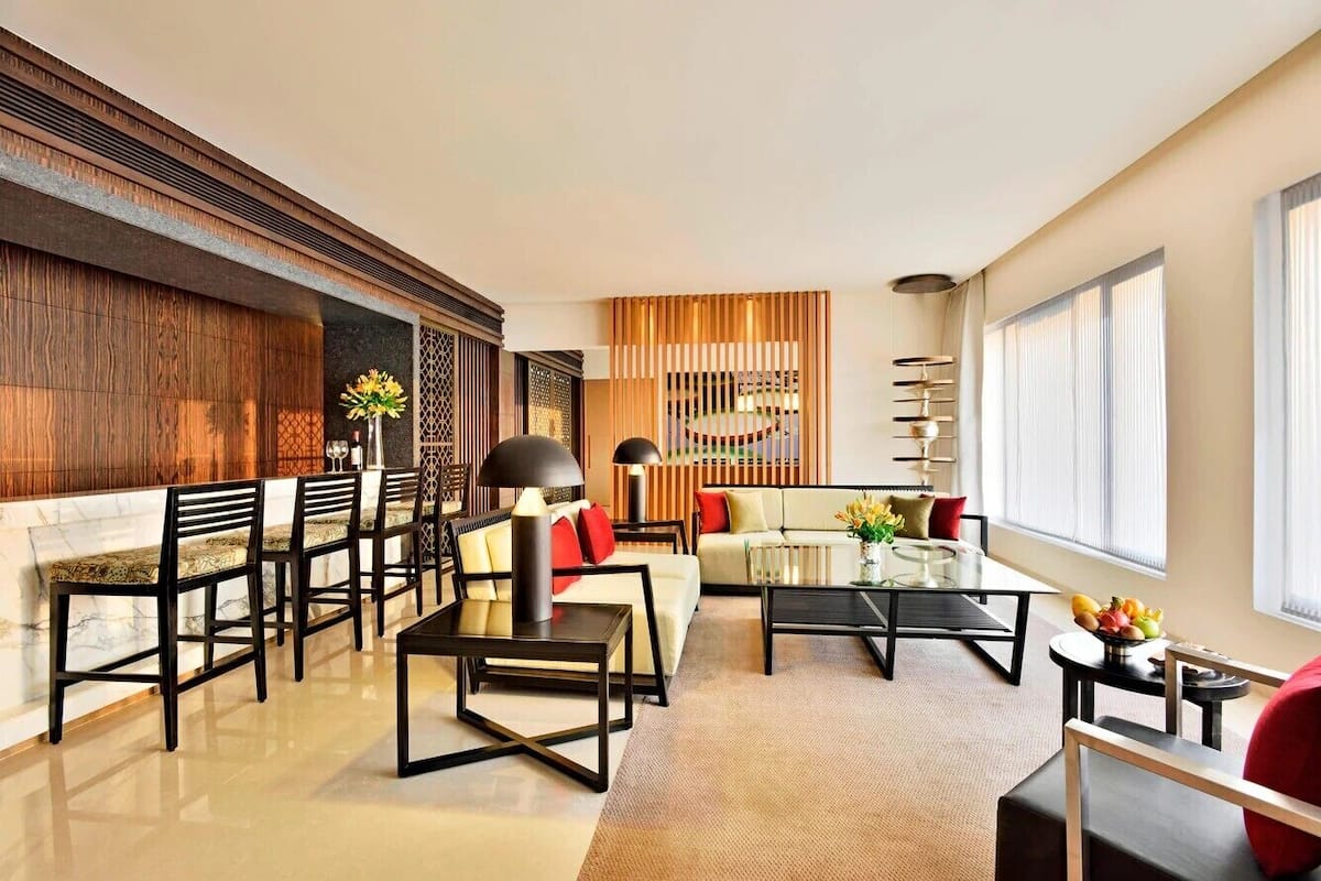 Luxury Suite, 1 Bedroom | Living area | 43-inch LCD TV with digital channels, TV, DVD player