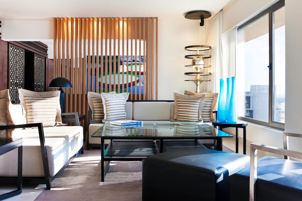 presidential suite, 1 king bed, non smoking, balcony | living area | 43-inch lcd tv with digital channels, tv, fireplace