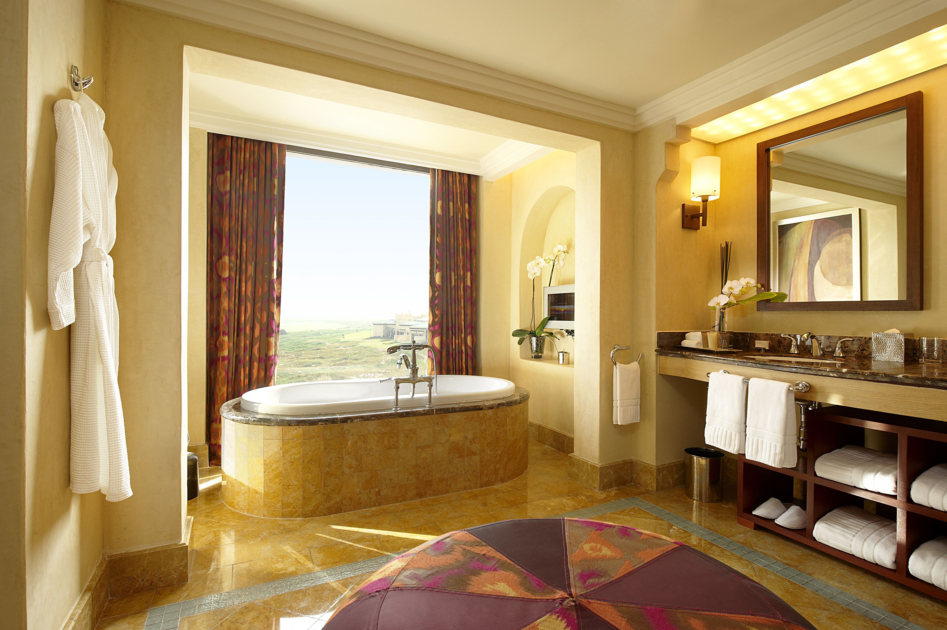 separate bathtub and shower, rainfall showerhead, hair dryer, bathrobes