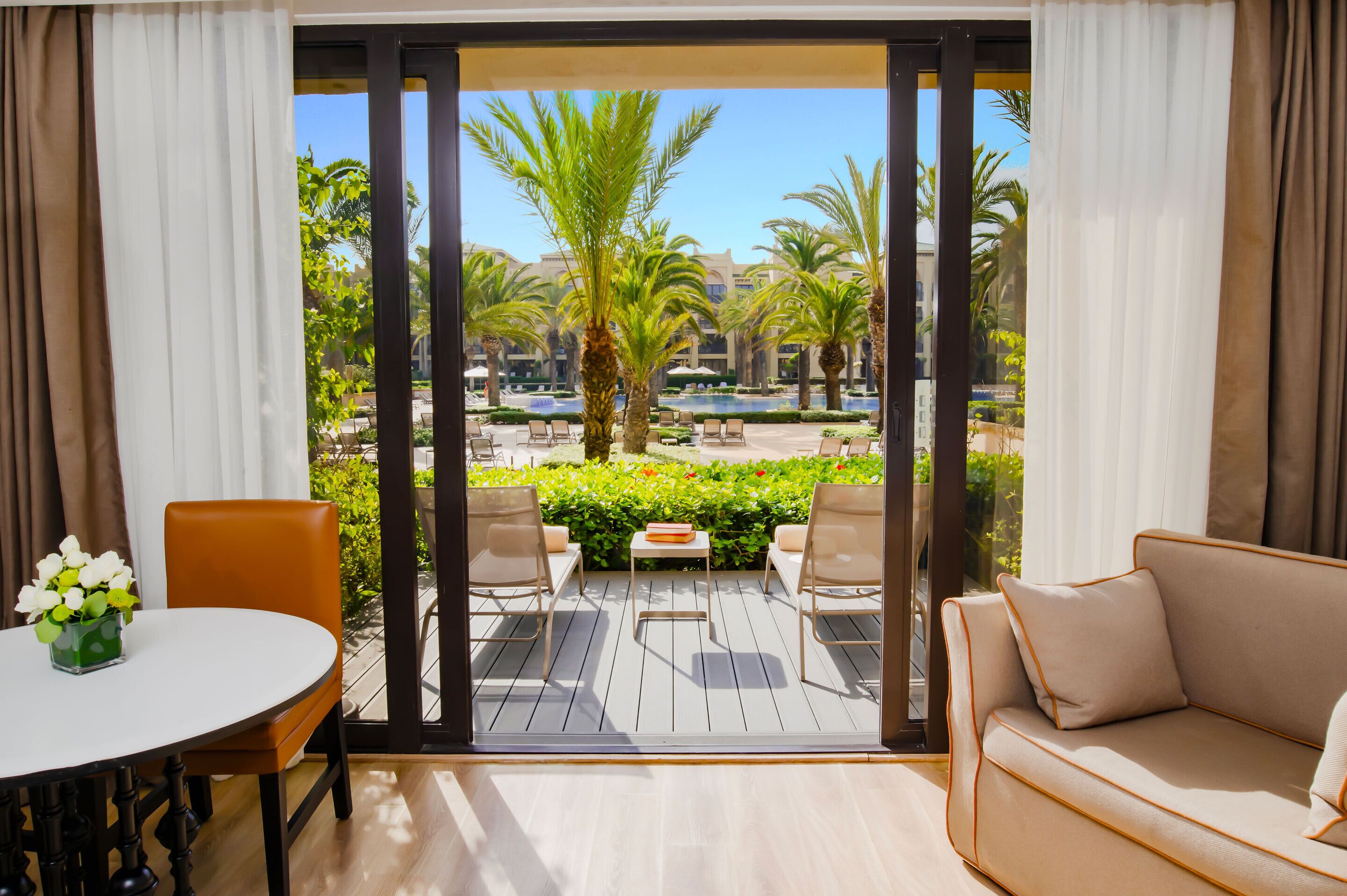 pool view king patio room | minibar, in-room safe, laptop workspace, iron/ironing board