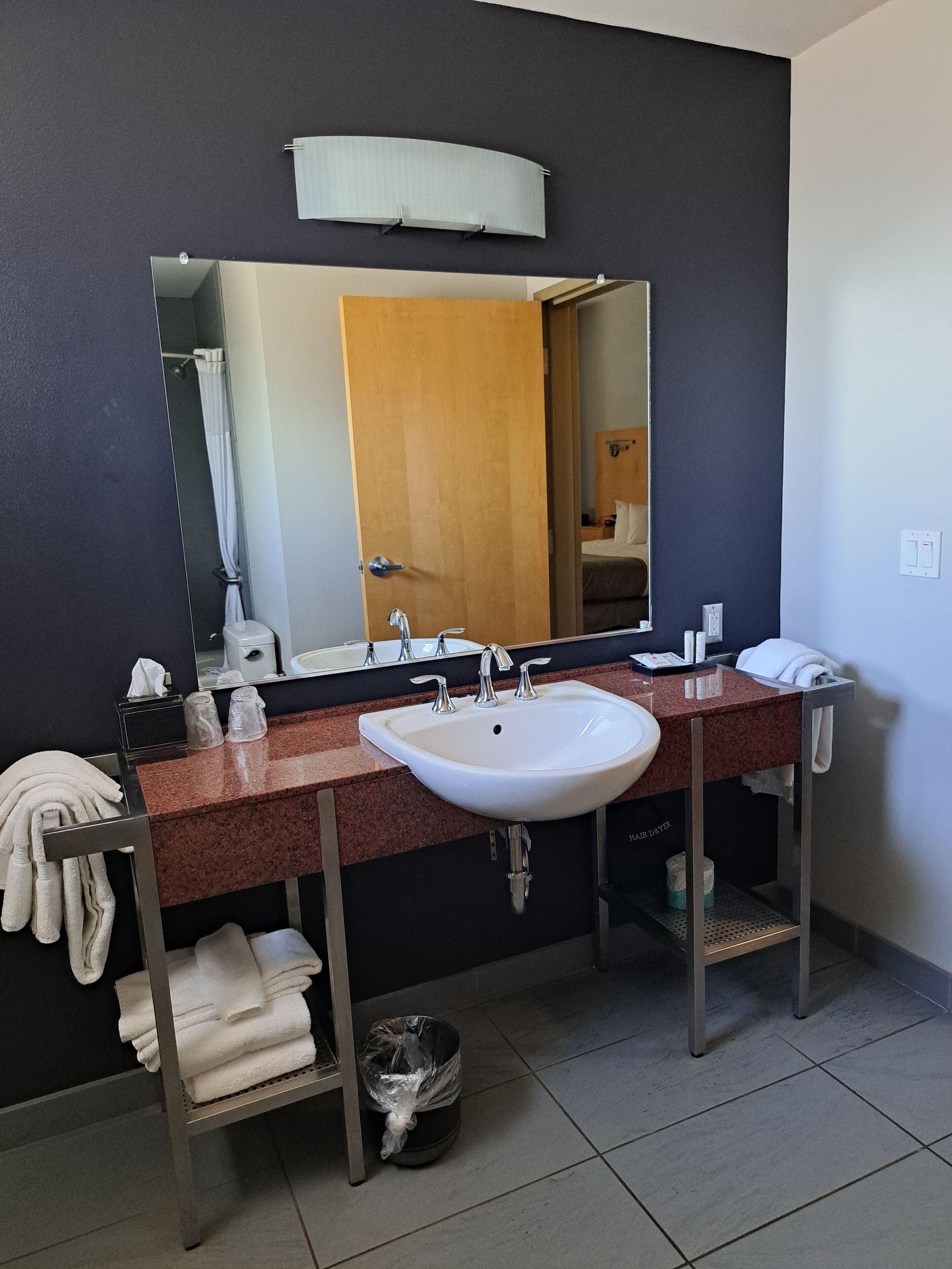 combined shower/bathtub, designer toiletries, hair dryer, towels