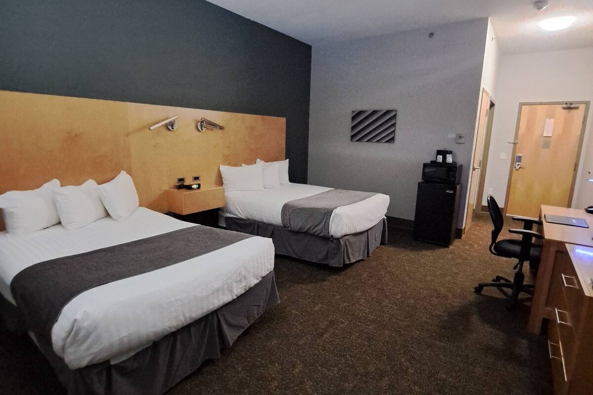 double room, 2 double beds | in-room safe, desk, soundproofing, iron/ironing board